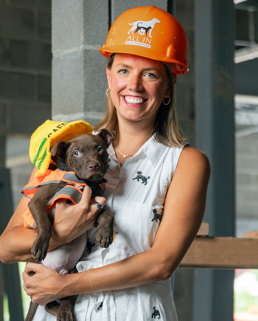 Alisa Oether Gray holding a rescue puppy at the Kentucky Humane Society